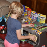 Hadley setting up display of donated pet supplies.