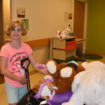 Hadley with stuffed toys in a wagon.