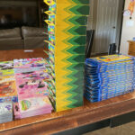 School supplies stacked on table.