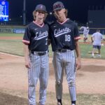 Baseball players posing on the field.