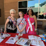 Hadley with women wearing sashes.