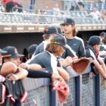 Young baseball players wait on the sidelines at the Duel on the Diamond event