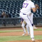 Baseball player winds up a pitch at the Duel on the Diamond event